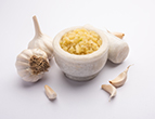 garlic paste lahsun puree with raw whole isolated white background selective focus