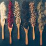 top view dried herbs spoons 90x90
