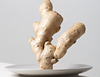 vertical closeup ginger plate table lights against white background